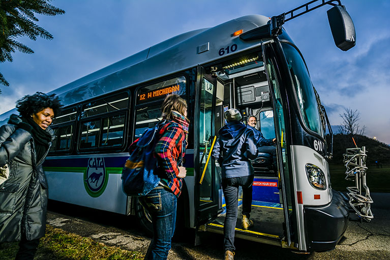 Students board a CATA bus