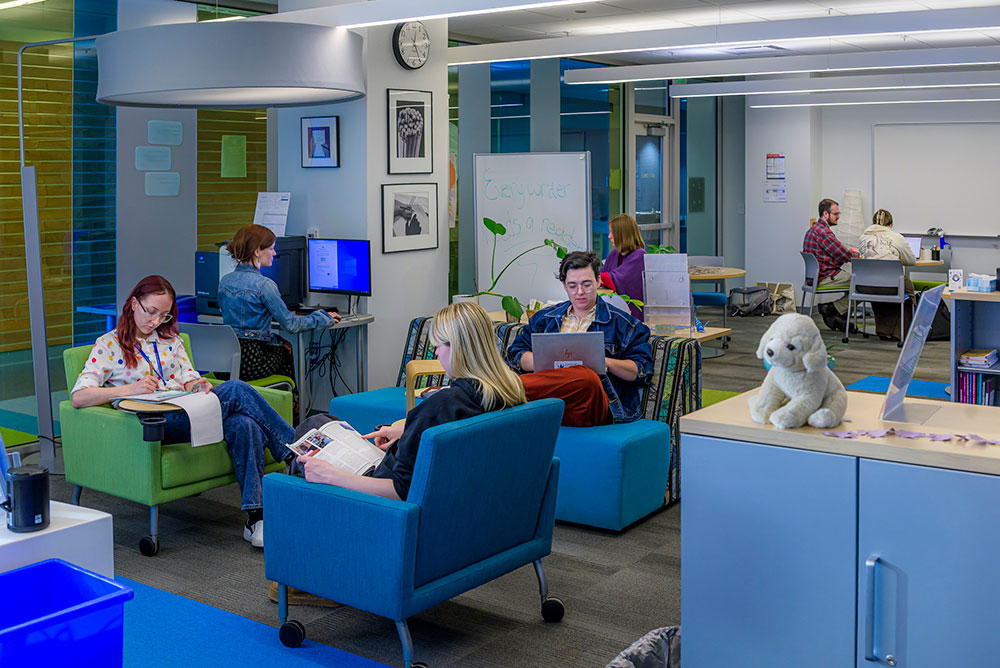 student studying in the writing center lounge
