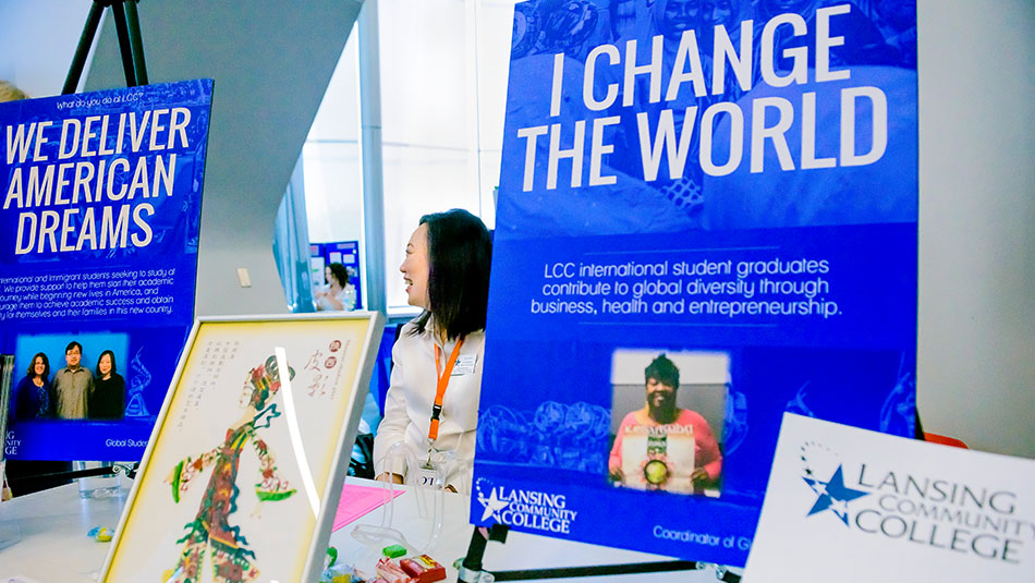 Engagement Resources Fair table with sign stating I change the world