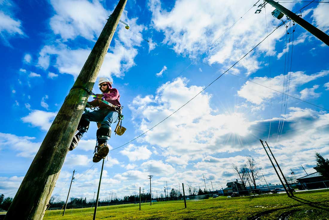 Lineworker student on training utility pole