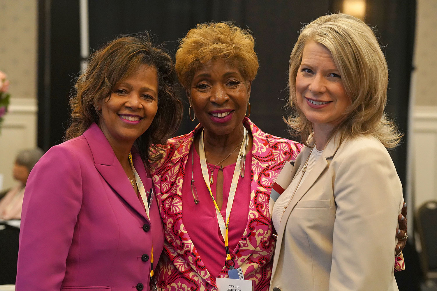 ace women's network michigan logo on a podium on stage